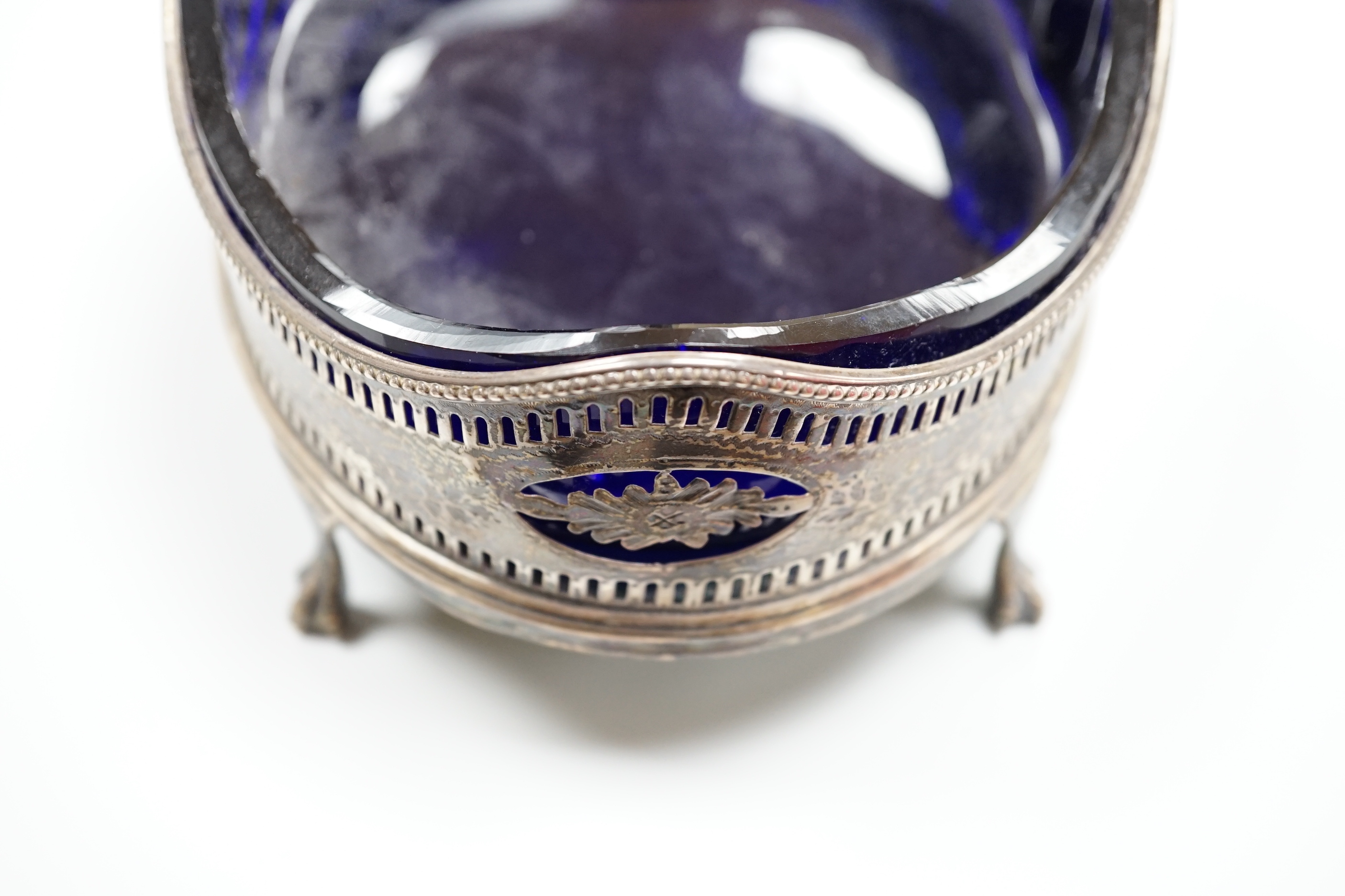 A George III pierced silver oval cruet stand base?, London, 1804, maker's mark rubbed, 17.5cm, now with blue glass liner(a.f.).